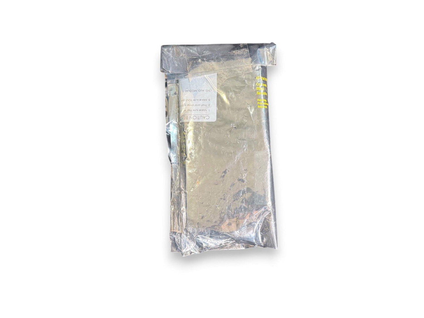 Sealed fire alarm module in anti-static bag with caution label for safe handling