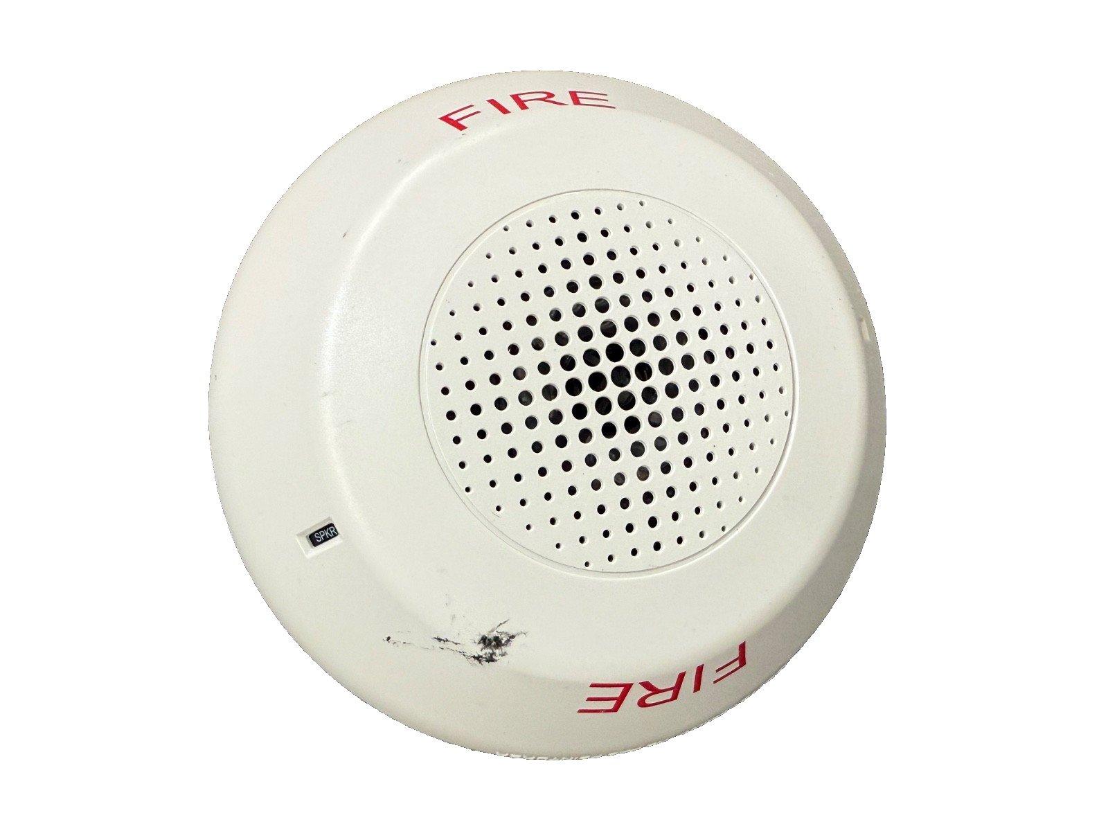 White fire alarm speaker with red FIRE label and perforated grille for emergency alert systems