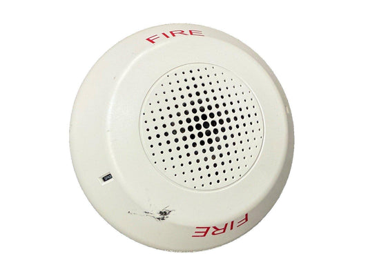 White fire alarm speaker with red FIRE label and perforated grille for emergency alert systems