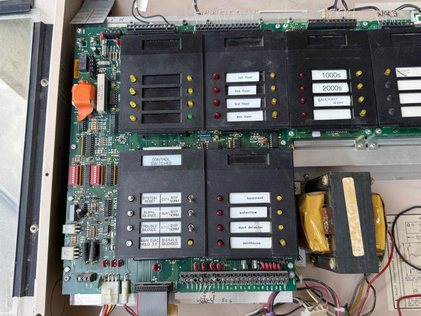 Fire alarm control panel circuit board with floor zone indicators and control switches