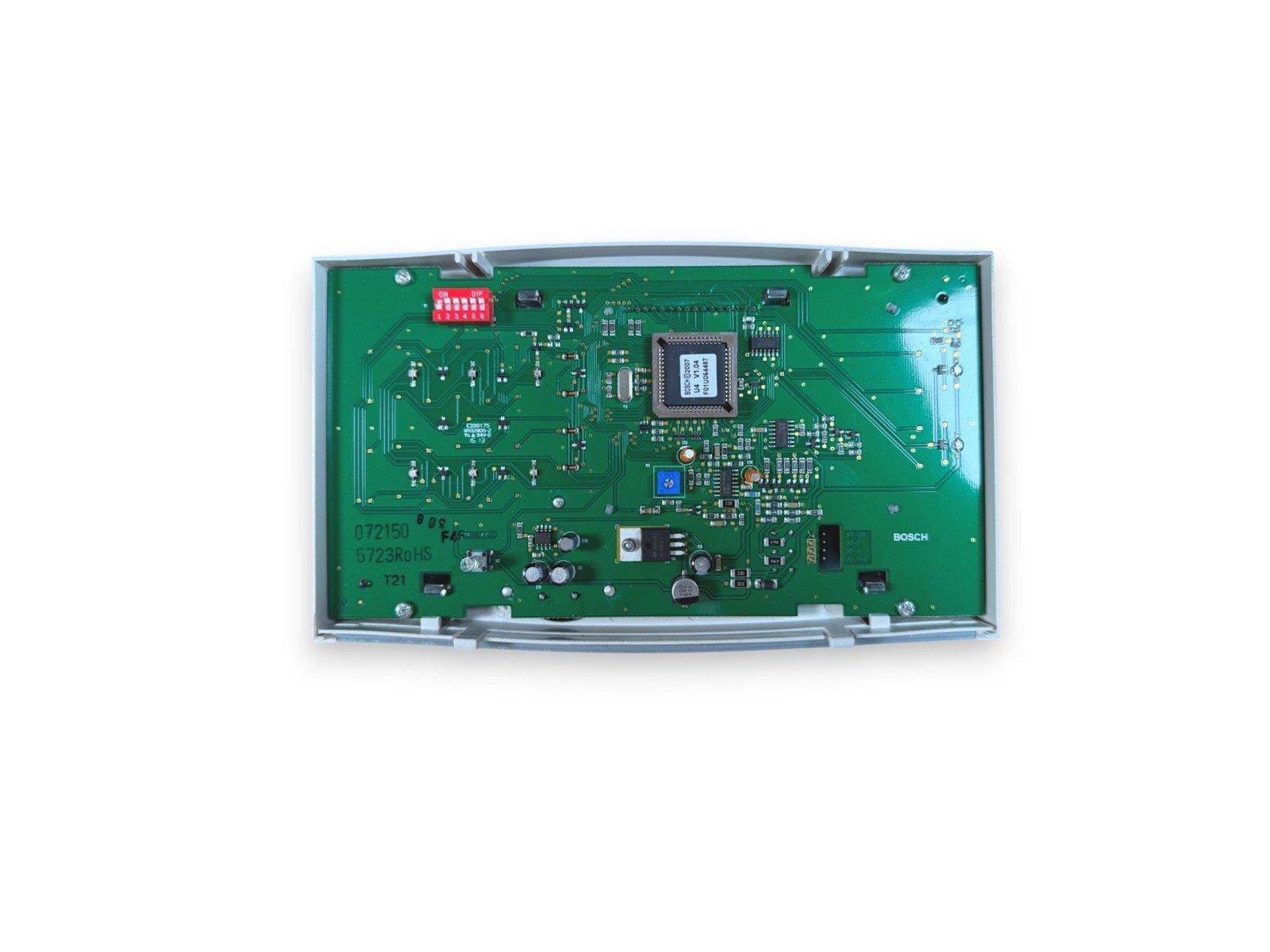 Bosch fire alarm control panel circuit board with DIP switches and microchip