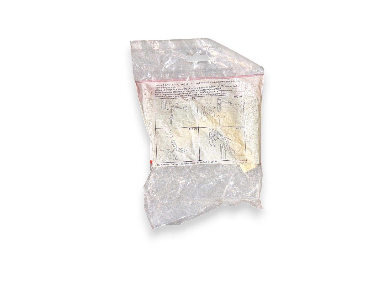 Fire alarm mounting hardware kit in clear plastic packaging with installation diagrams