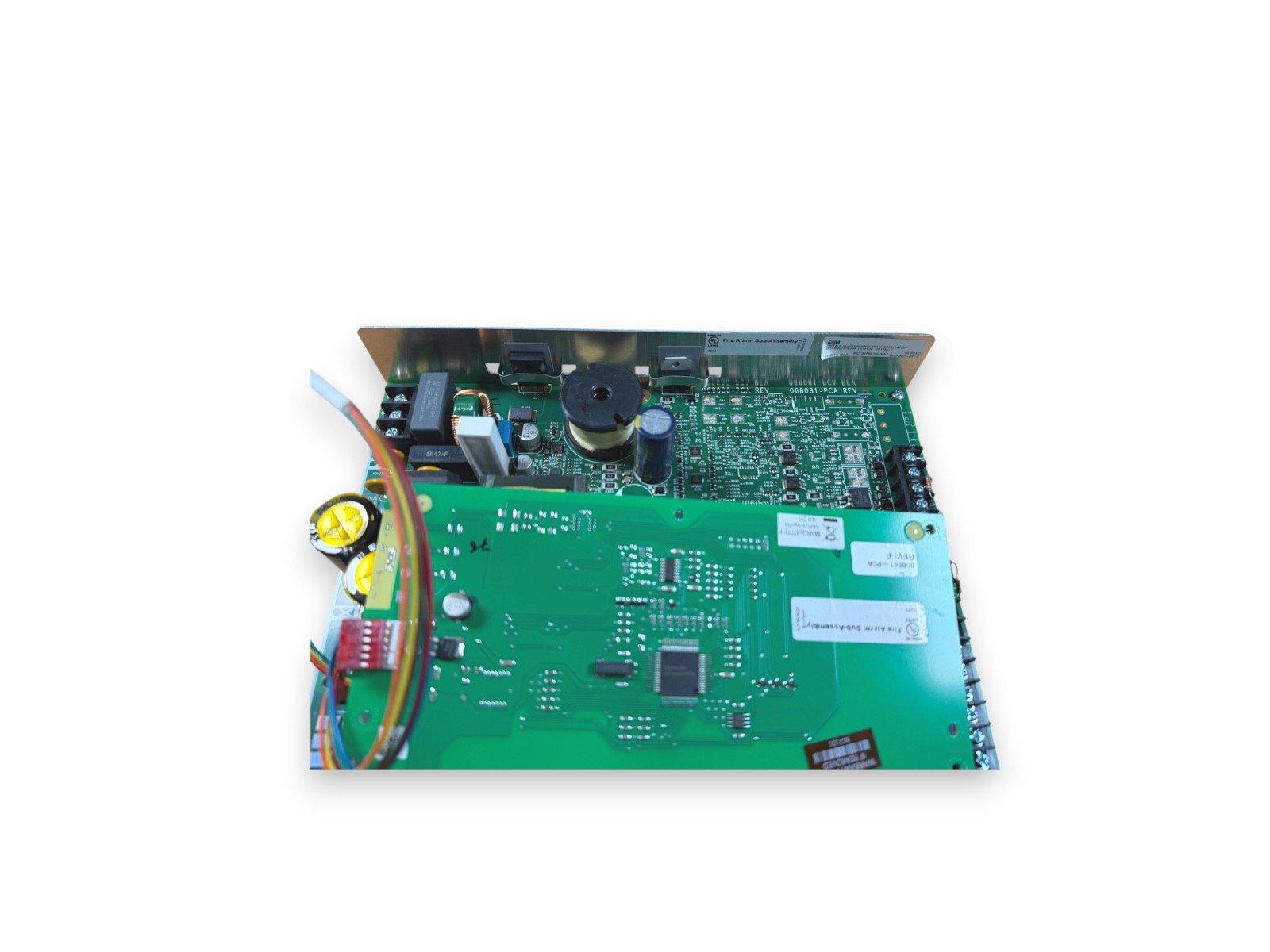Fire alarm control panel circuit board with capacitors and wiring, used fire alarm equipment