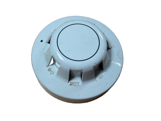 White fire alarm smoke detector with 'DO NOT PAINT' warning, used fire safety equipment