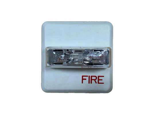 White fire alarm strobe light with red FIRE label, used for emergency warning systems