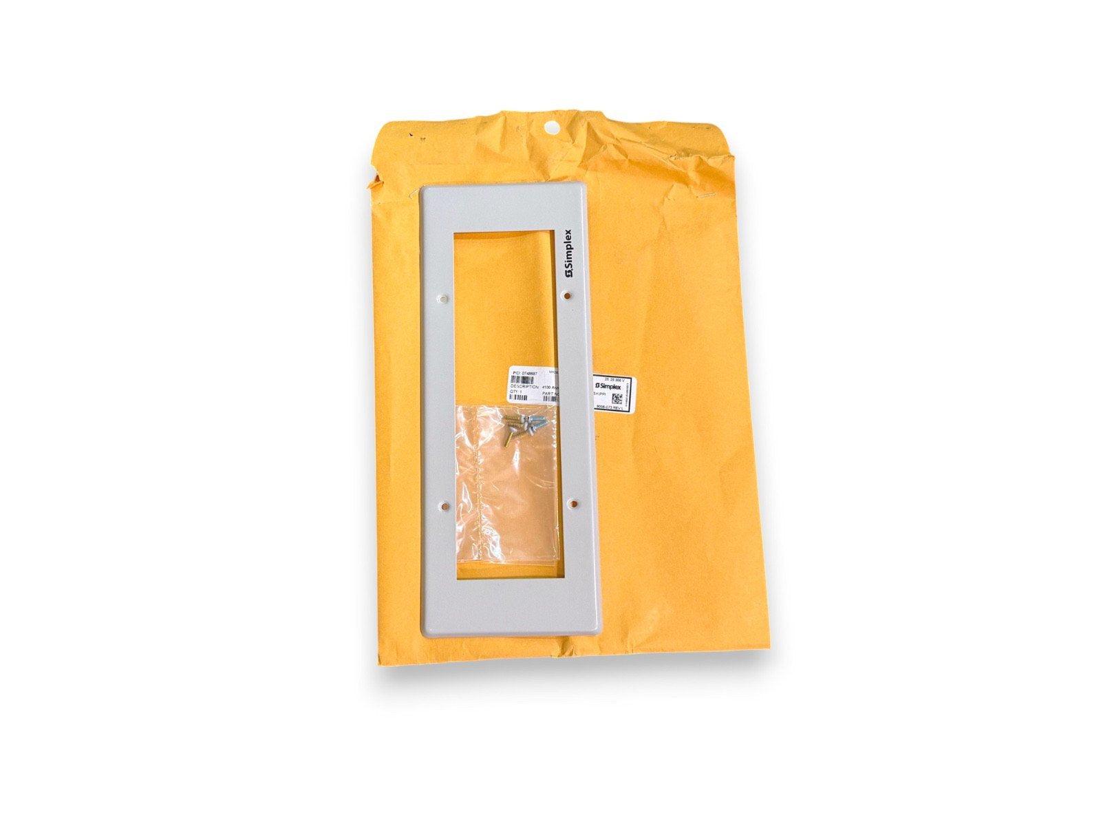 Simplex fire alarm panel cover with mounting hardware in yellow envelope, new surplus equipment