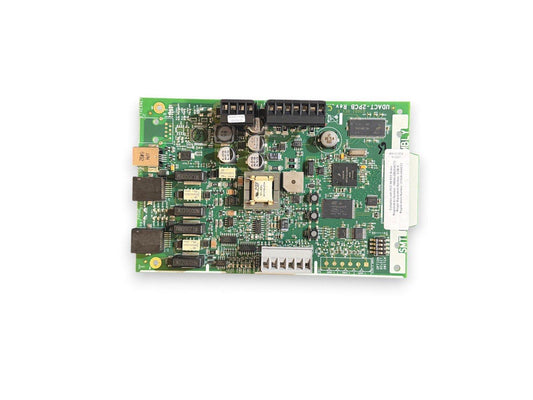 Green fire alarm control panel circuit board with connectors and components for fire safety systems
