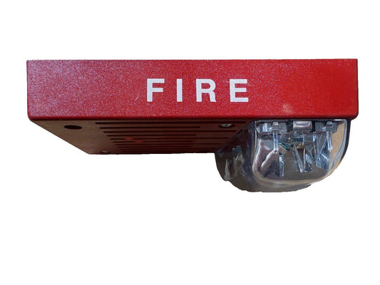 Red fire alarm horn strobe with 'FIRE' label, used fire alarm equipment