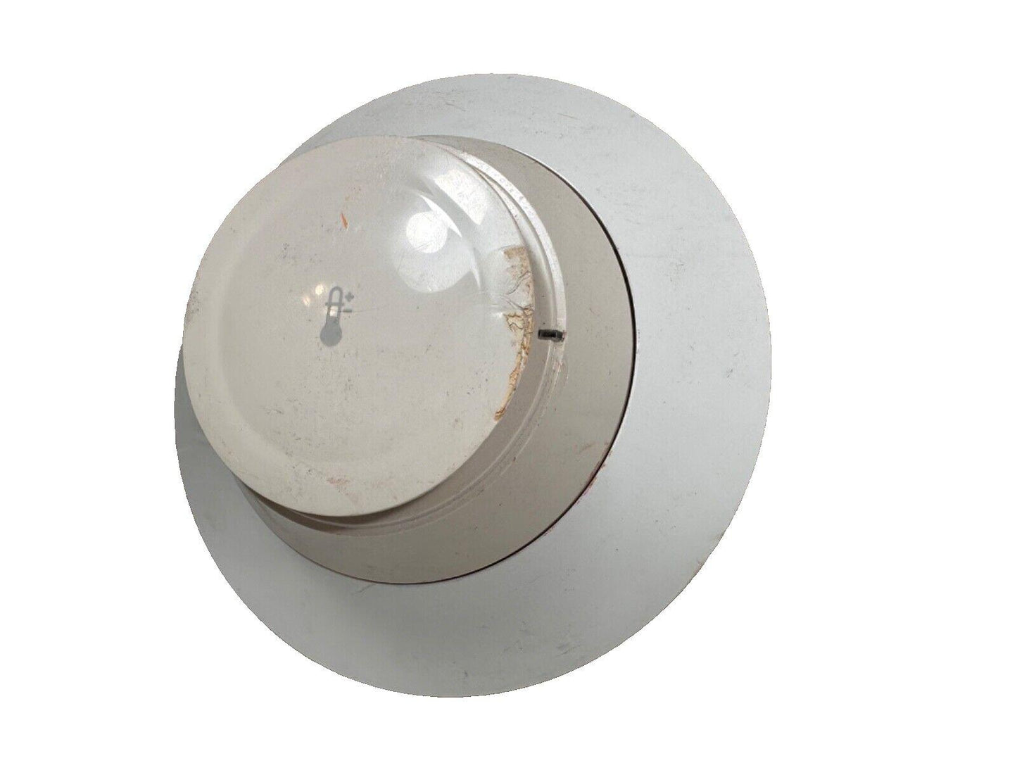 Used fire alarm heat detector with temperature symbol, white ceiling mount