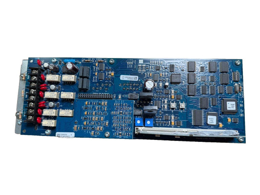 Blue fire alarm control panel circuit board with connectors and chips for fire safety systems