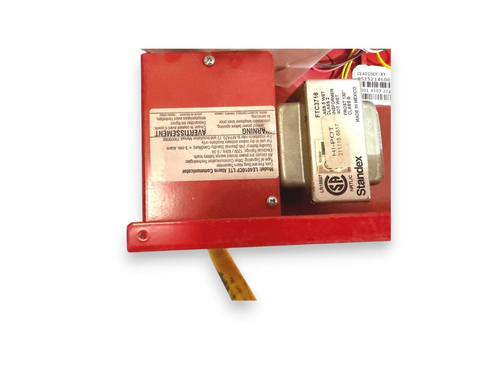 Red fire alarm communicator with Standex transformer, model LE4010CF LTE, for fire safety systems