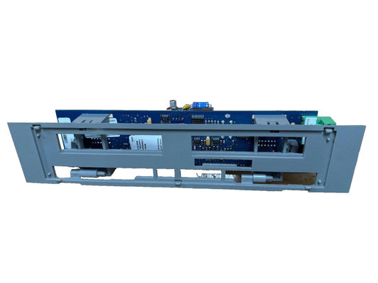 Fire alarm control panel circuit board with blue PCB and gray housing, showing internal components and connectors