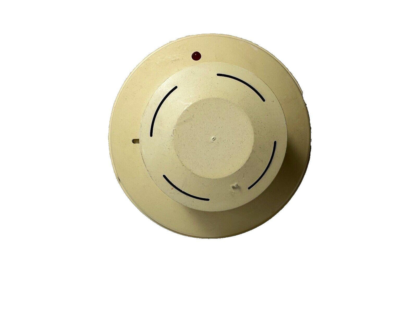Beige ceiling-mounted fire alarm detector with red LED indicator and curved vents