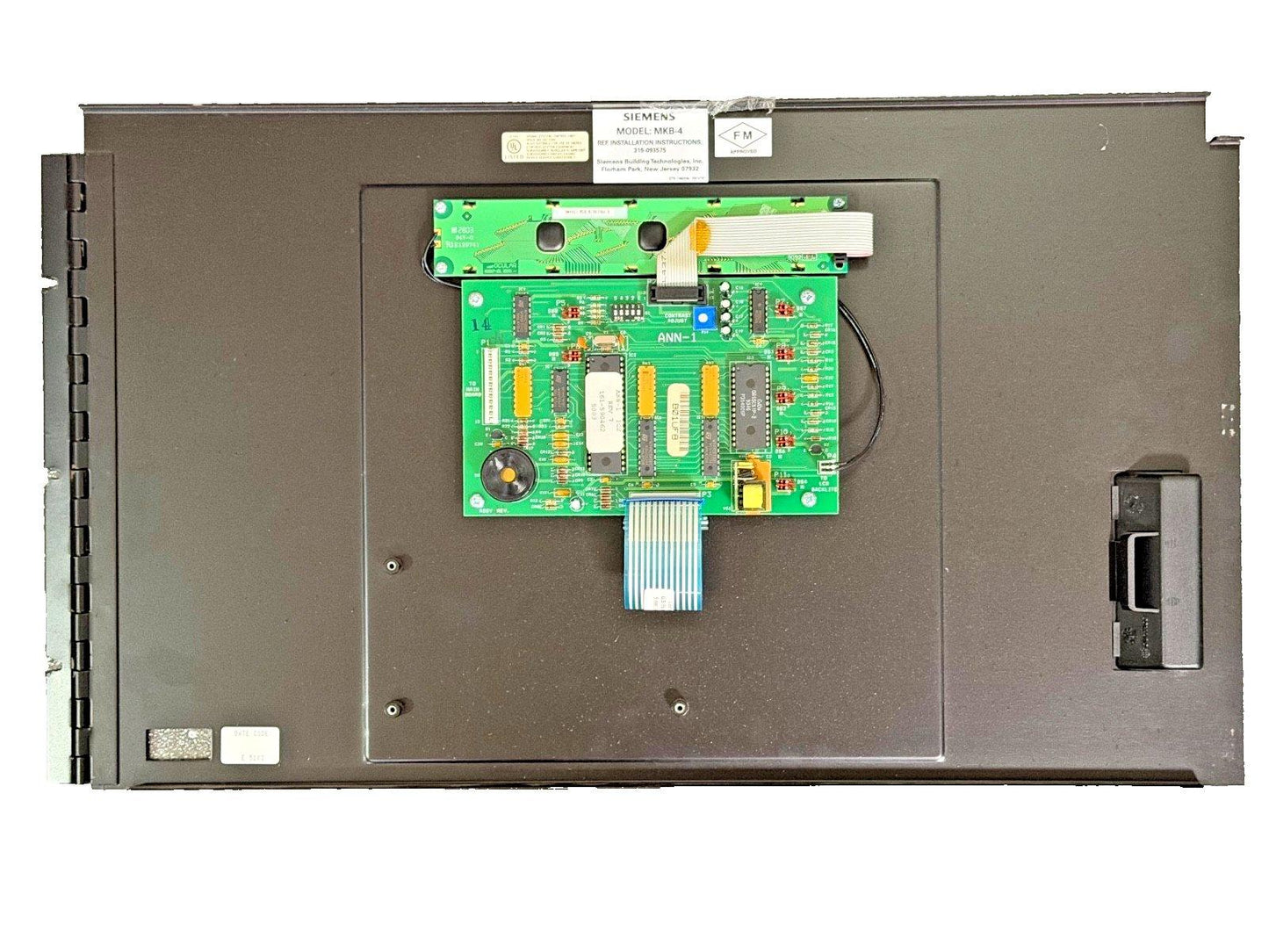 Siemens MKB-4 fire alarm control panel with green circuit boards and FM approved label