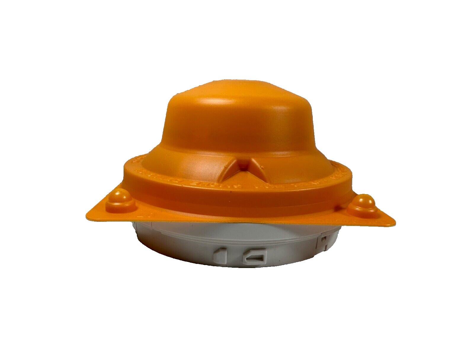 Orange fire alarm detector cover with white base, used for fire safety equipment protection