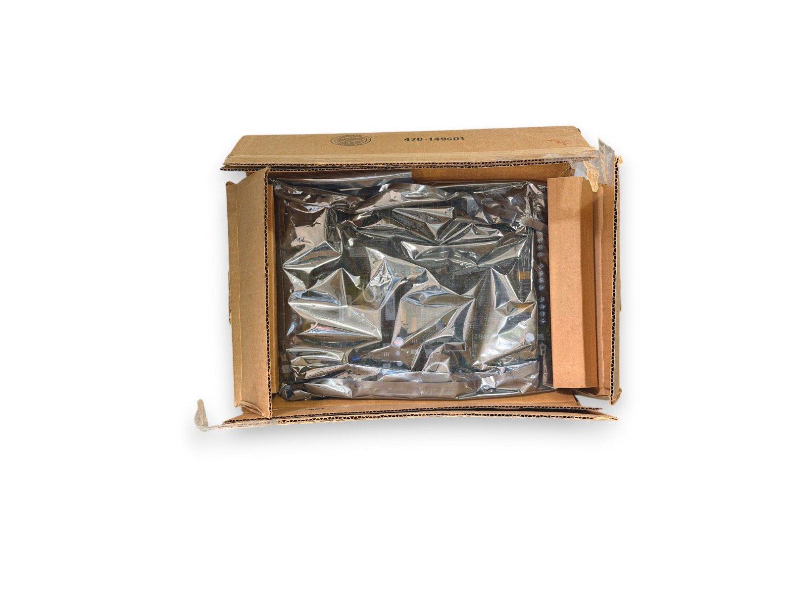 Fire alarm equipment in open cardboard box with protective plastic wrap, ready for shipping