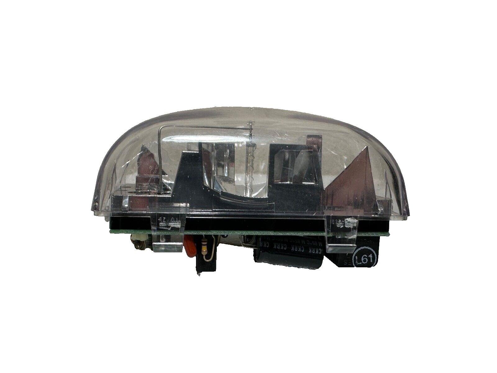 Fire alarm strobe light with clear dome cover and internal components visible