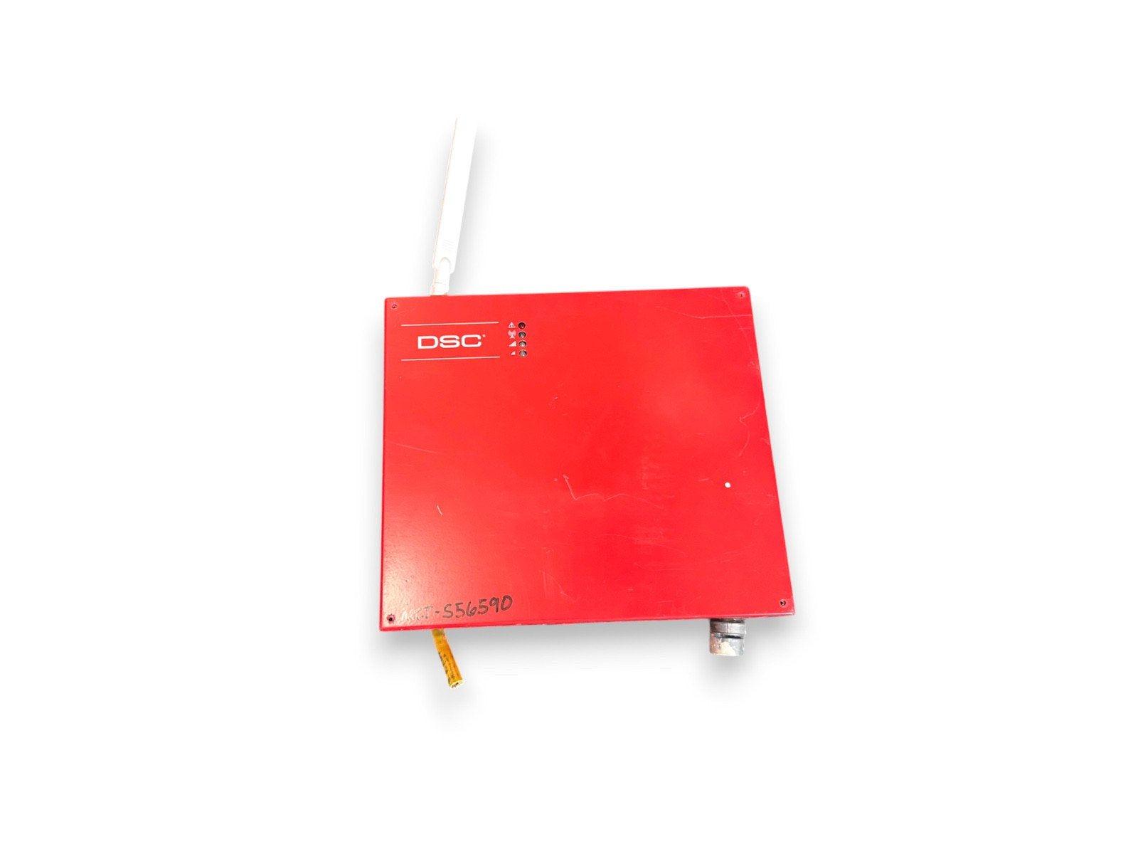 Red DSC fire alarm control panel with antenna and indicator lights, used fire safety equipment