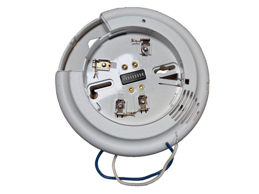 White fire alarm detector base with wiring terminals and mounting clips for commercial or residential use