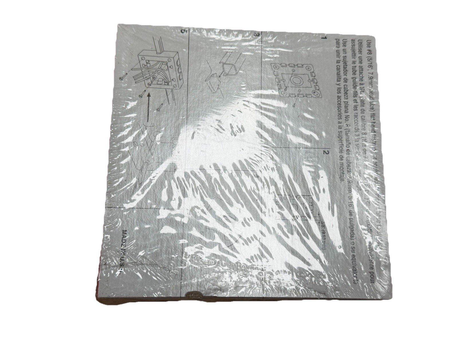 Fire alarm mounting instructions sheet with diagrams and multilingual text, wrapped in plastic