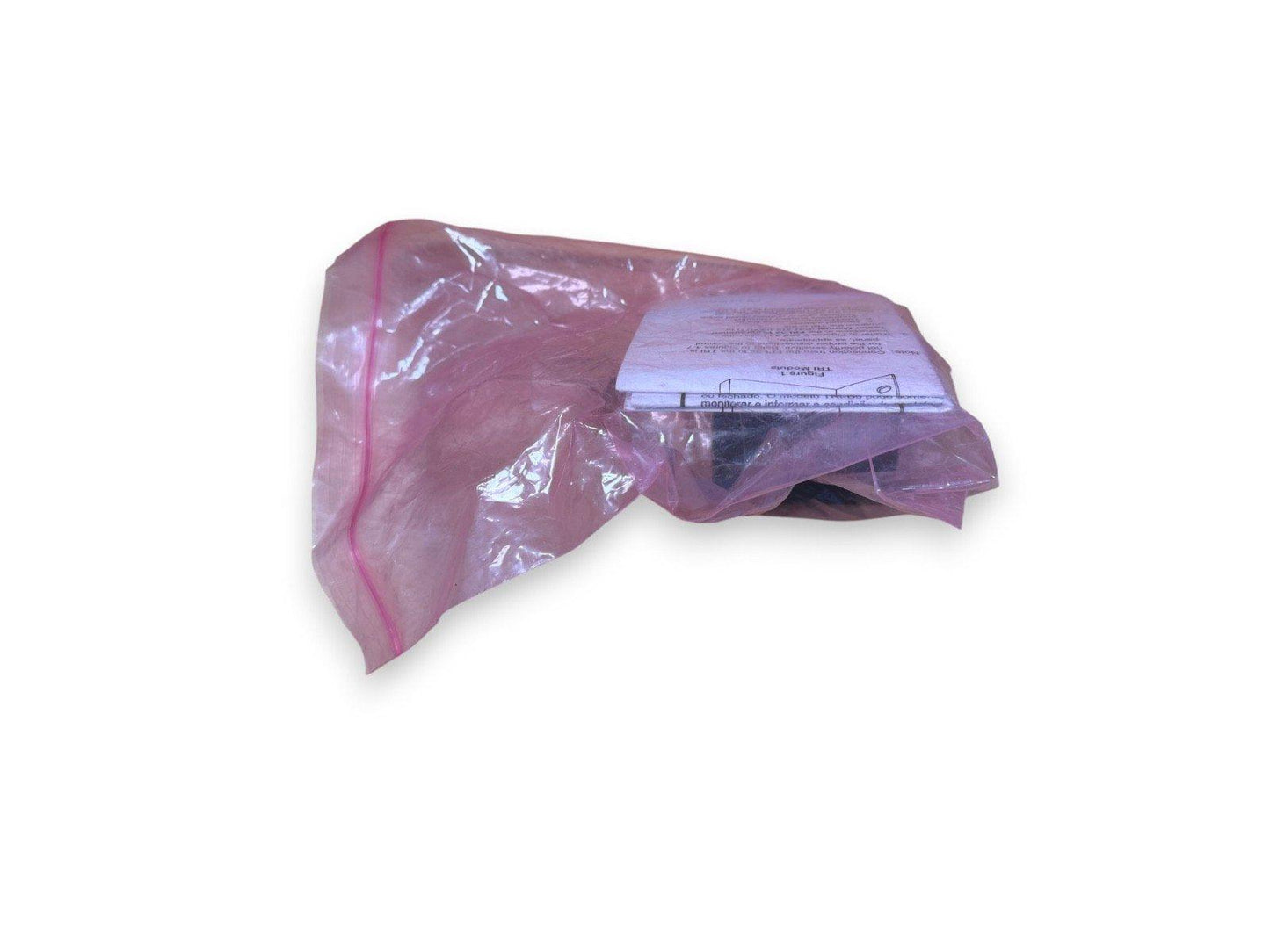Fire alarm module in pink plastic bag with instruction sheet, new surplus equipment
