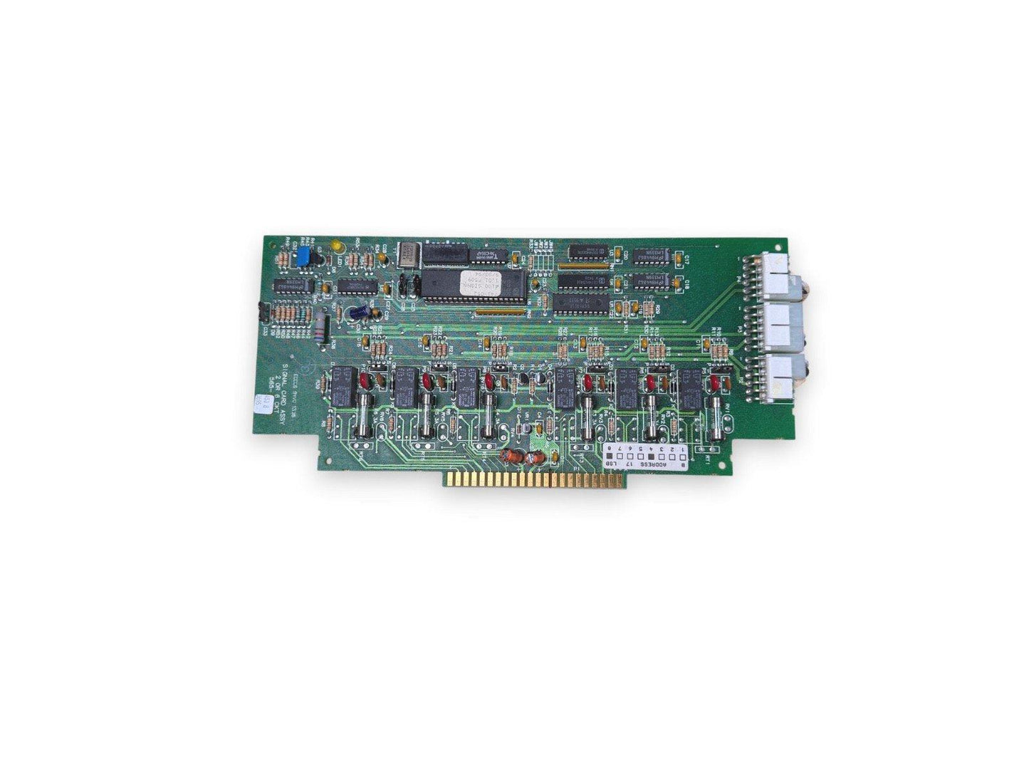 Green fire alarm control panel circuit board with connectors and chips for fire safety systems