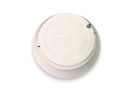 White ceiling-mounted fire alarm detector for commercial or residential safety systems