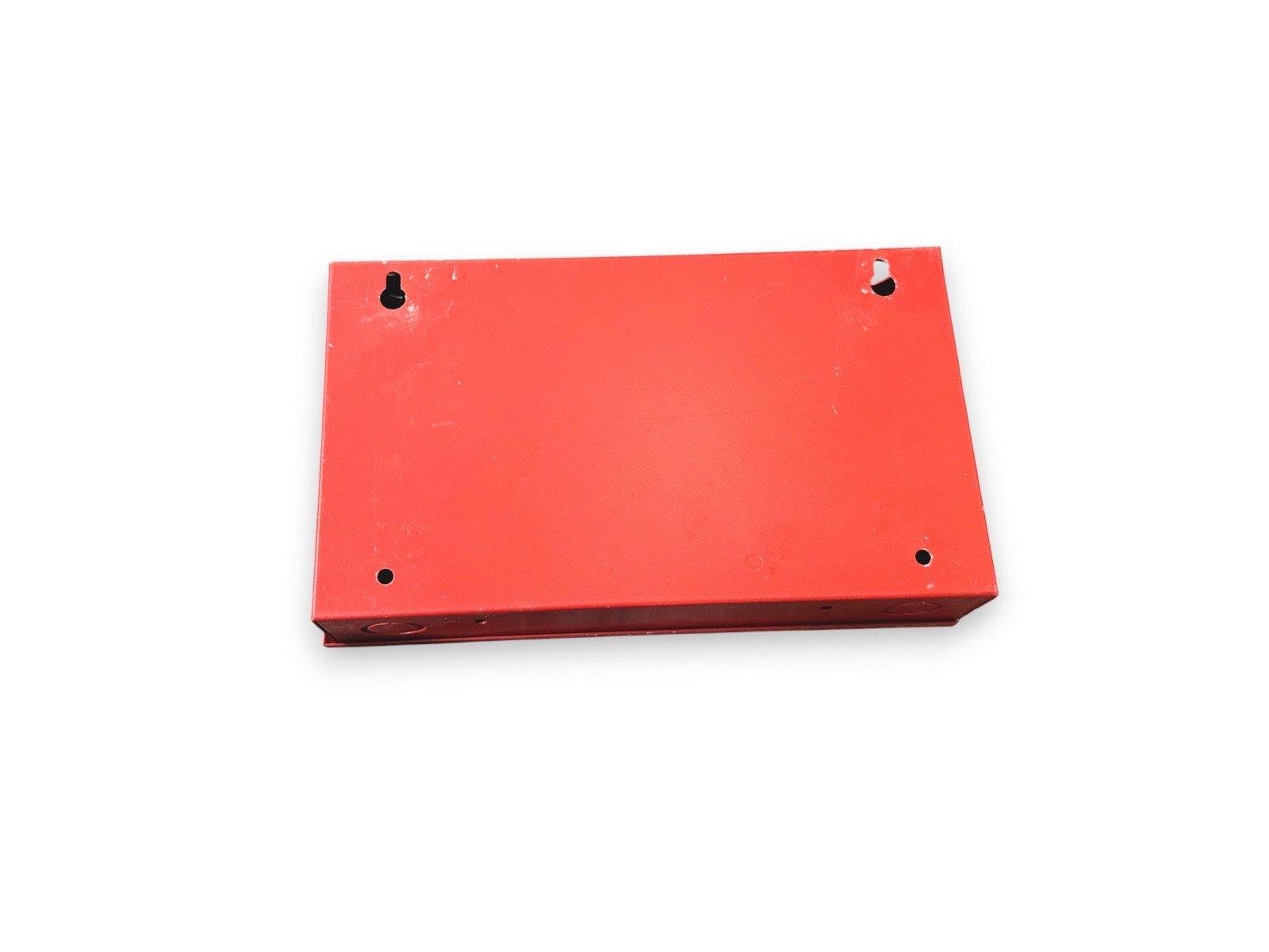 Red fire alarm control panel enclosure with mounting holes, used fire safety equipment