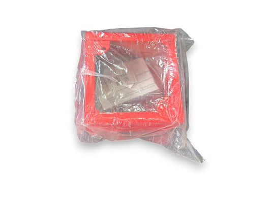 Red fire alarm pull station in clear plastic wrap, new surplus equipment