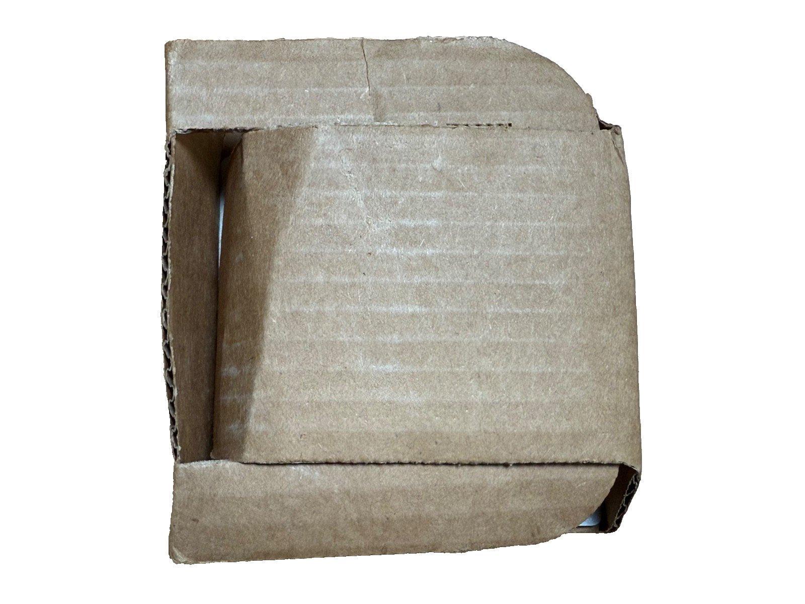 Used cardboard box for fire alarm equipment shipping, open and empty, showing corrugated interior