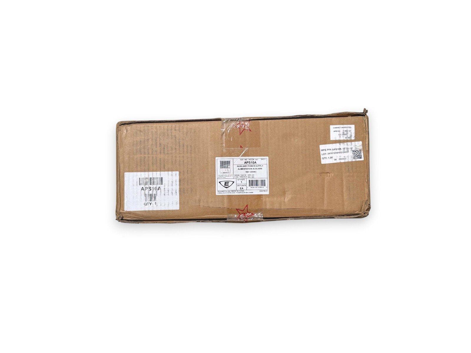 APS10A auxiliary power supply for fire alarm systems, packaged in cardboard box with labels and barcode