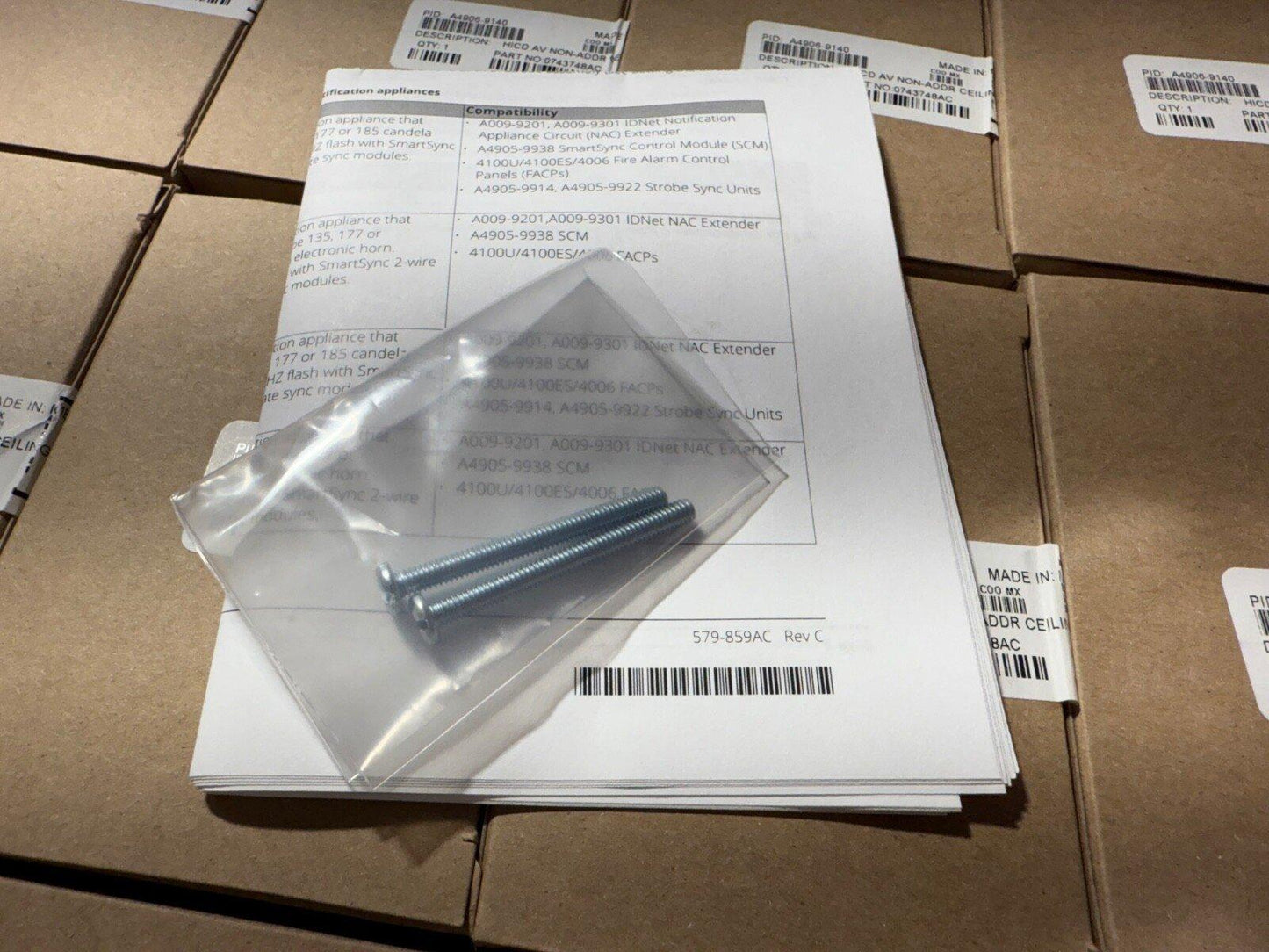 Fire alarm system mounting screws with compatibility guide for FACP and SmartSync modules