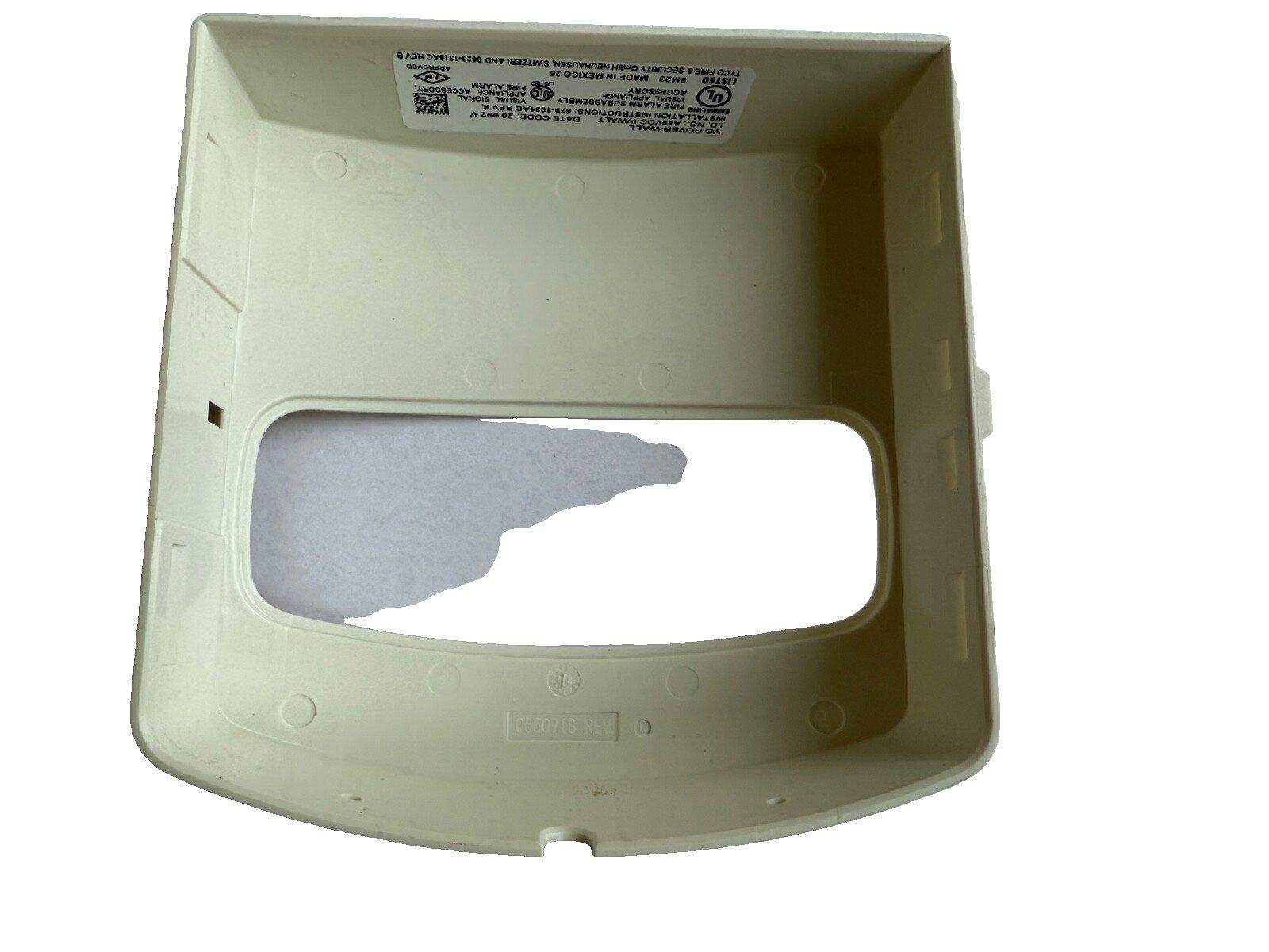 Beige fire alarm cover with UL listing label, for wall-mounted visual signal device