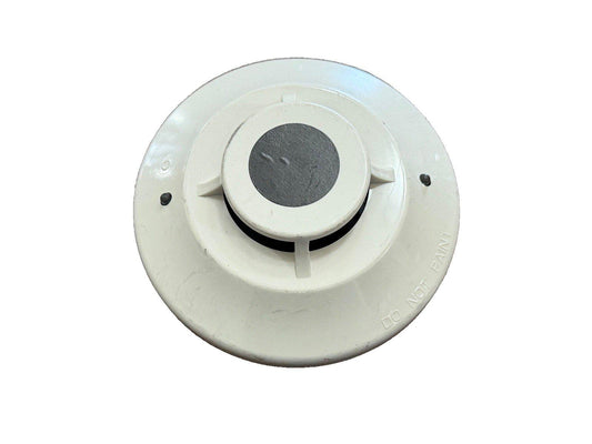 White smoke detector with 'DO NOT PAINT' label, fire alarm safety device