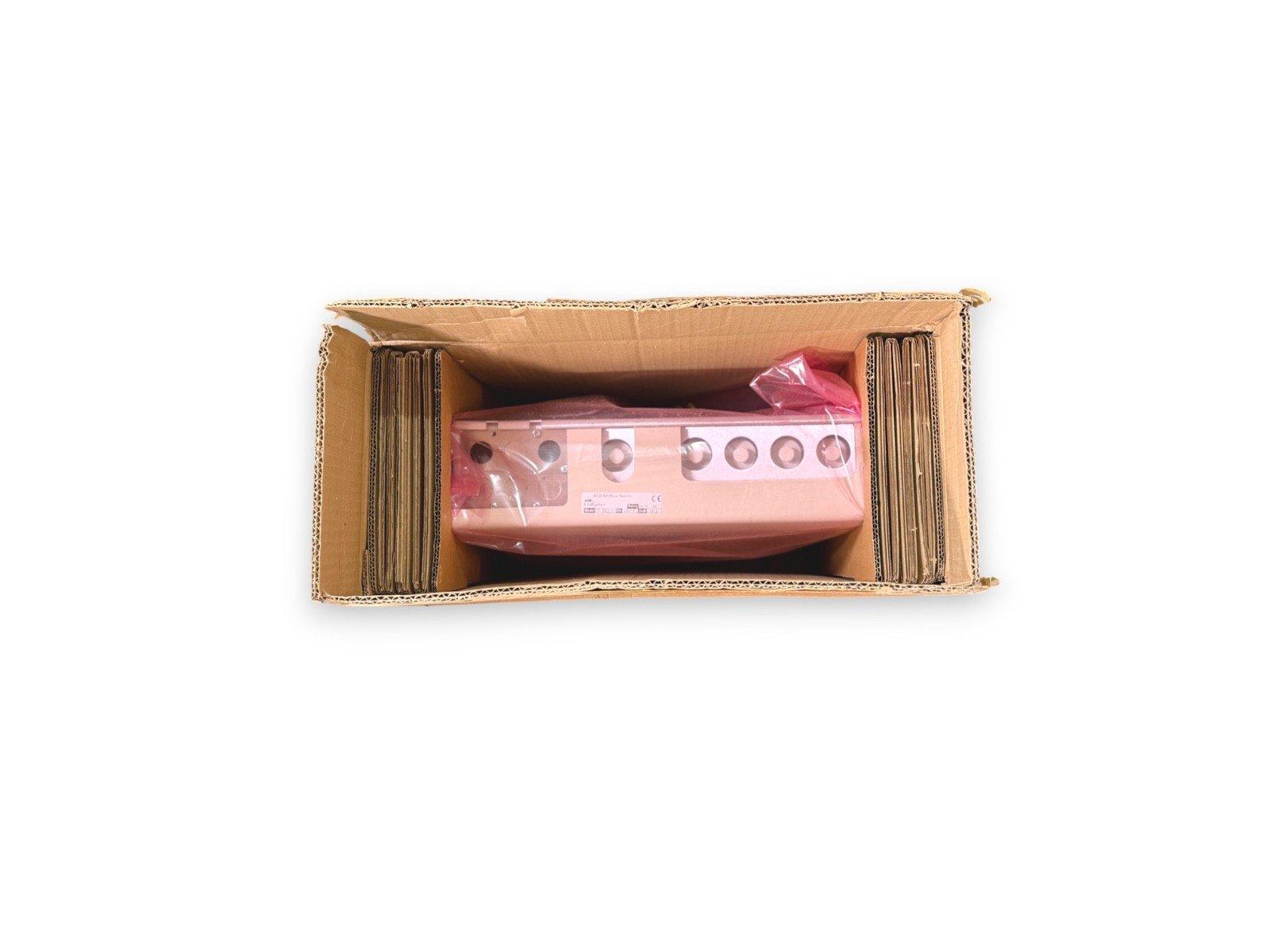 Fire alarm control panel in shipping box, wrapped for protection, ready for installation