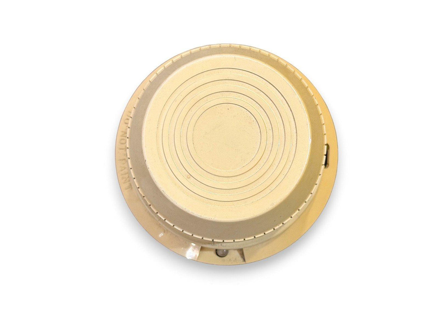 Beige fire alarm detector with concentric rings and 'DO NOT PAINT' text, top view