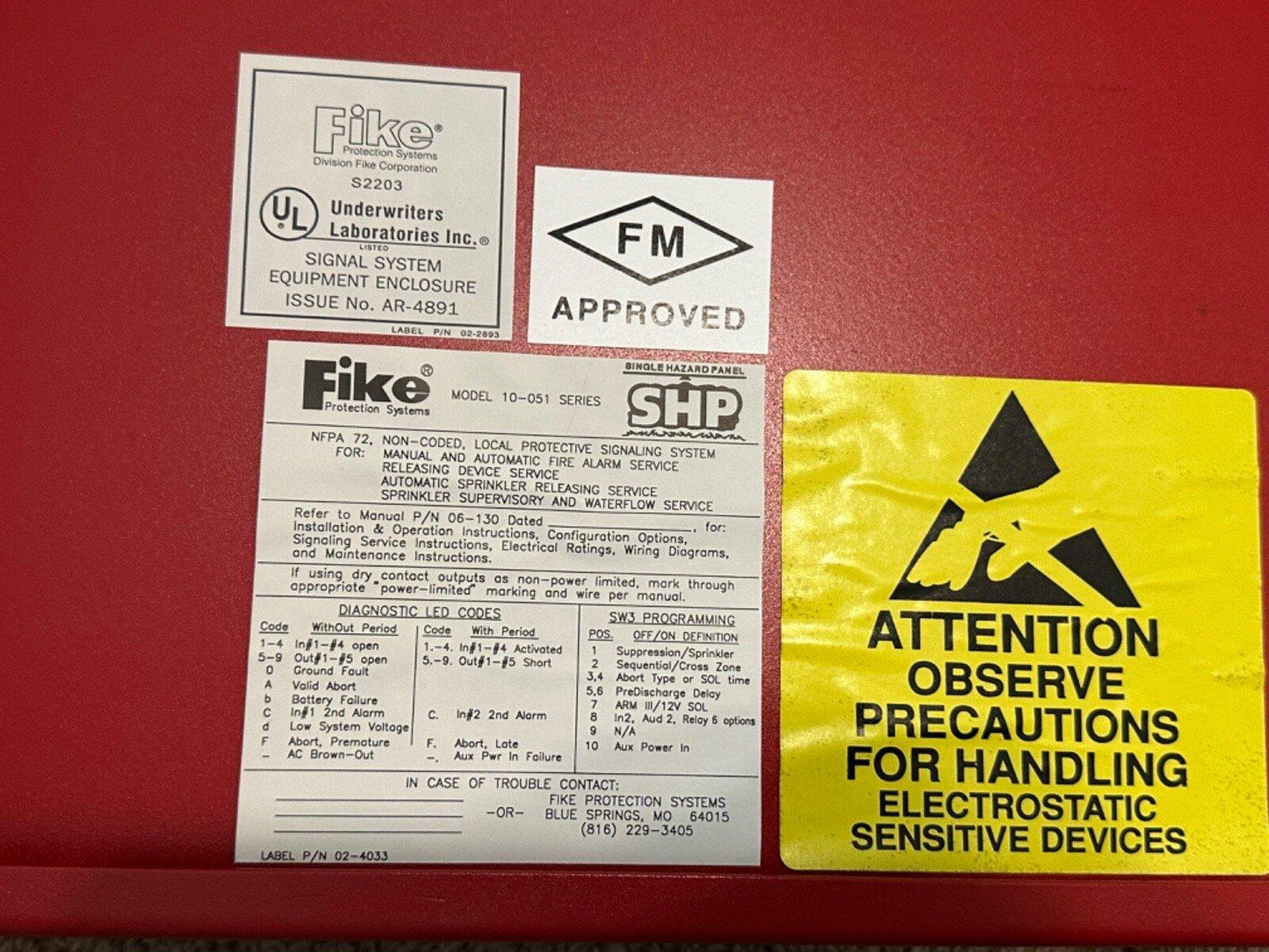 Fike fire alarm control panel with UL, FM approval labels and ESD warning sticker