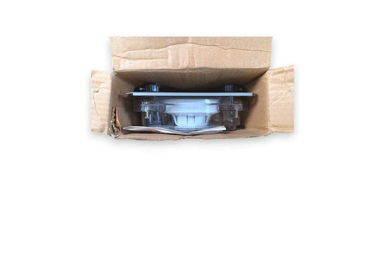 Fire alarm device in open cardboard box, ready for installation or shipping