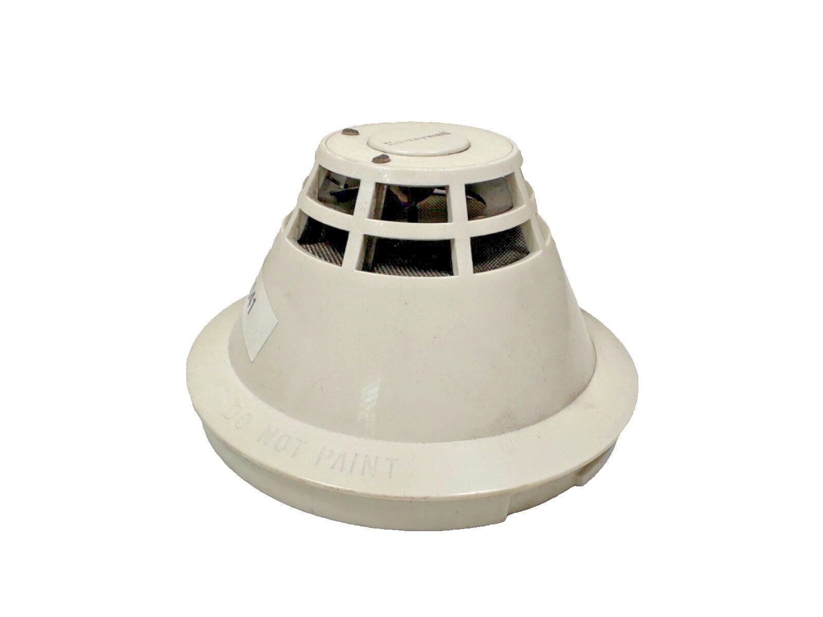 White smoke detector with vented design and 'DO NOT PAINT' label, fire alarm safety equipment