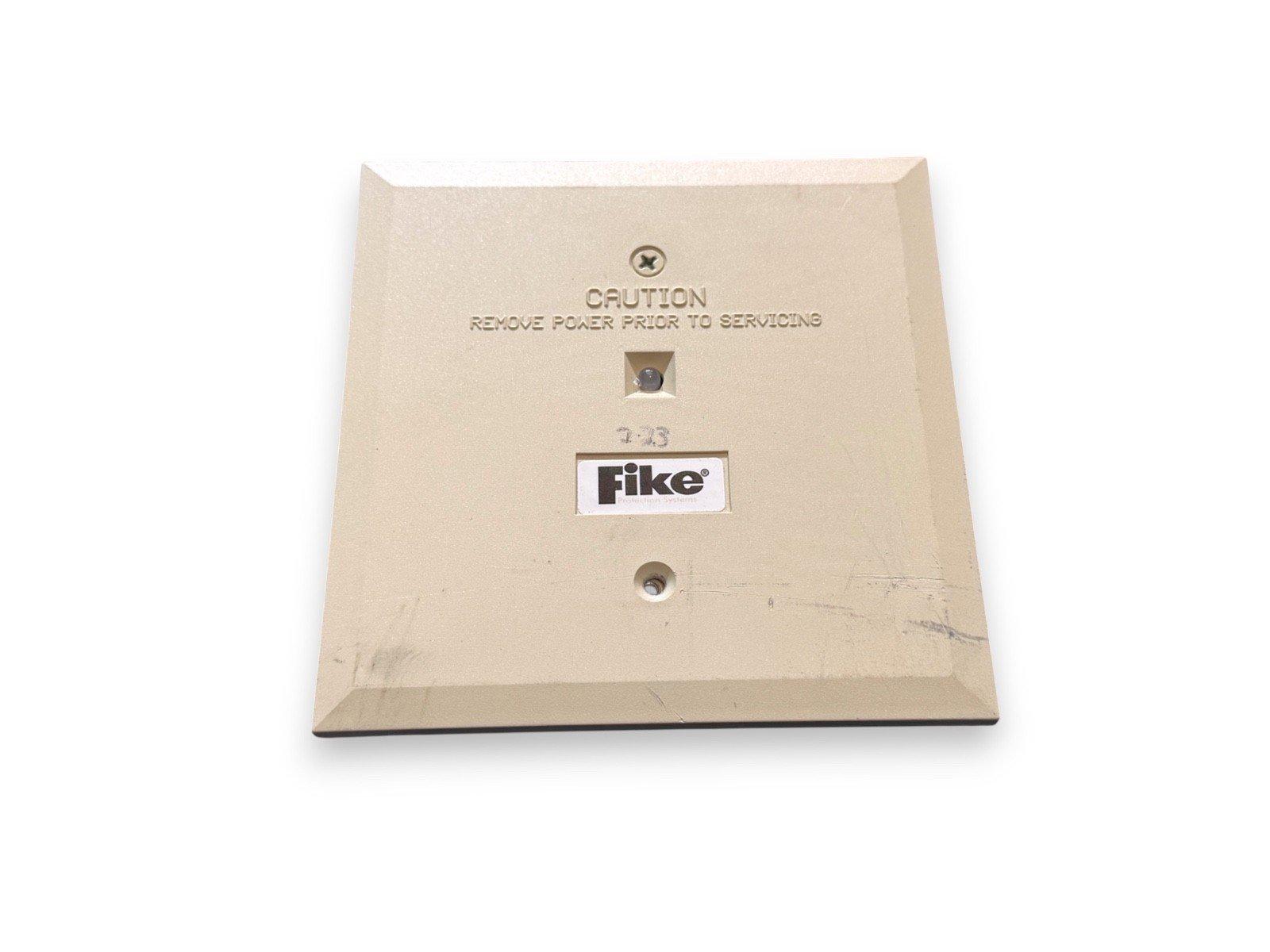 Fike fire alarm control panel backplate with caution label and mounting holes