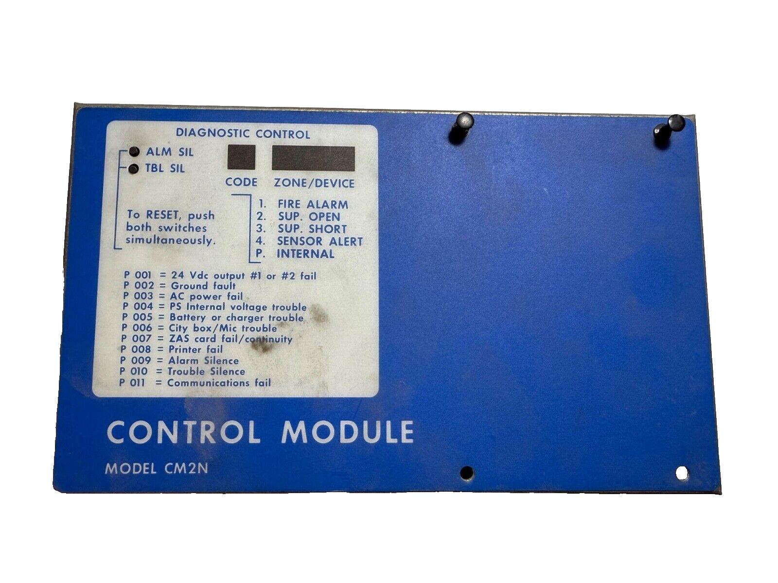 Blue fire alarm control module CM2N with diagnostic panel and reset instructions