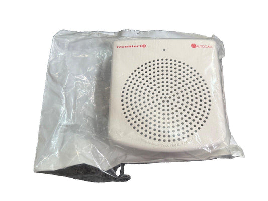 TrueAlert ES fire alarm device in plastic wrap, white square with perforated speaker grille