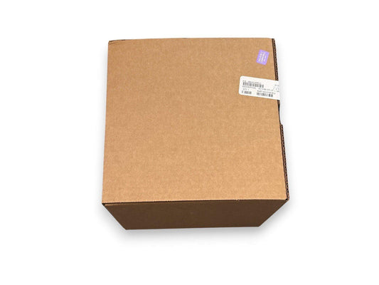 Cardboard box with shipping label and purple sticker, containing fire alarm equipment part