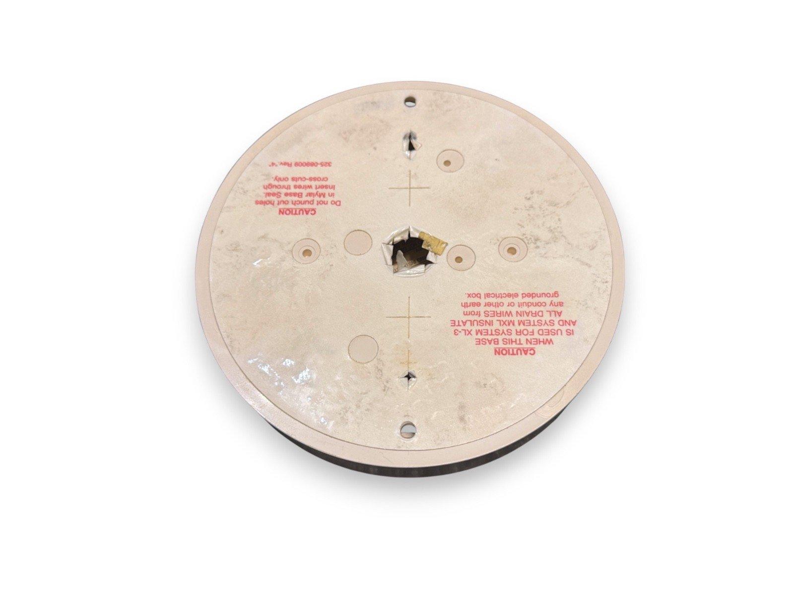Fire alarm base with wiring holes and caution labels, compatible with System XL-3