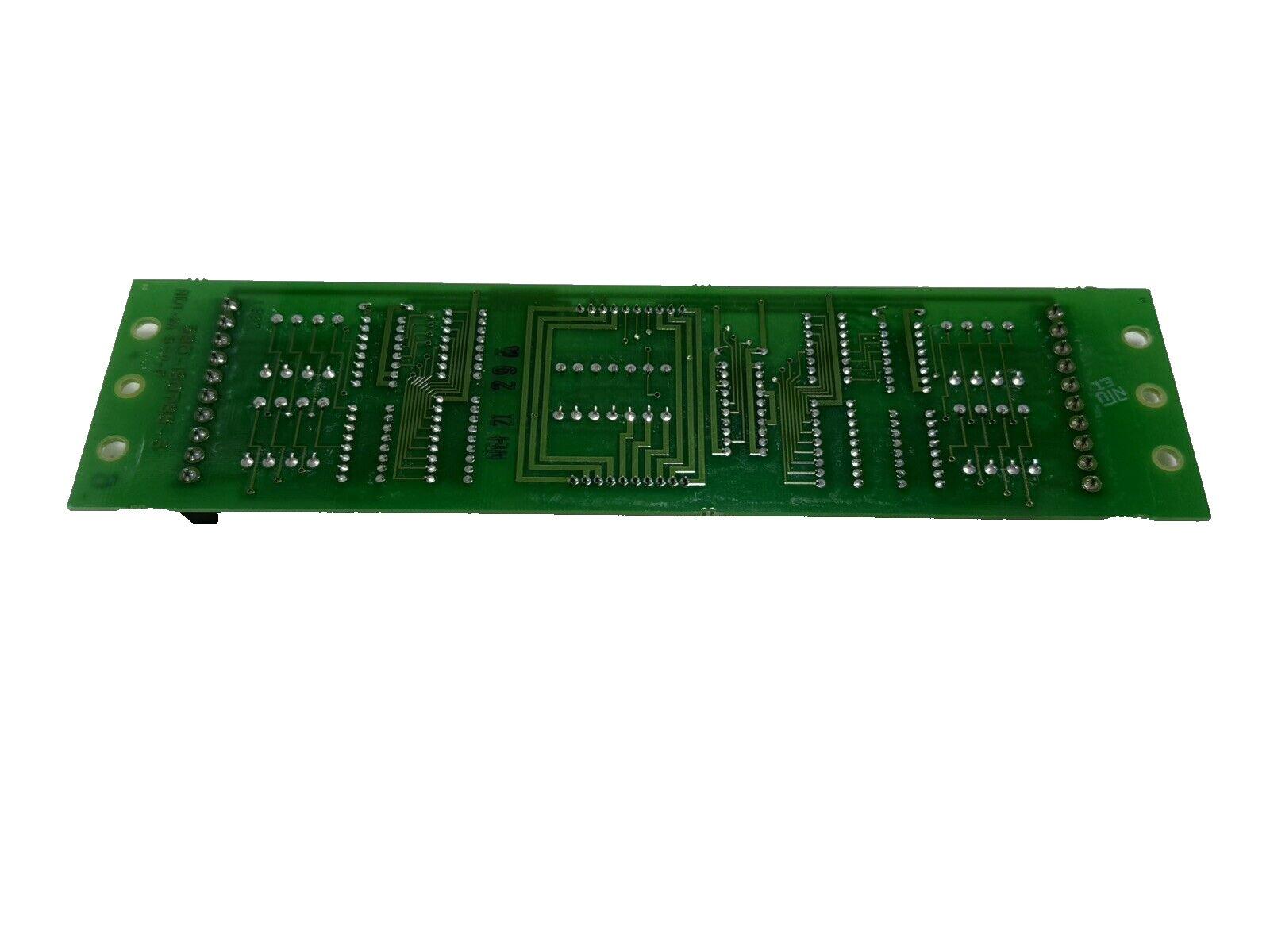 Green fire alarm control panel circuit board with solder points and traces, used fire alarm equipment