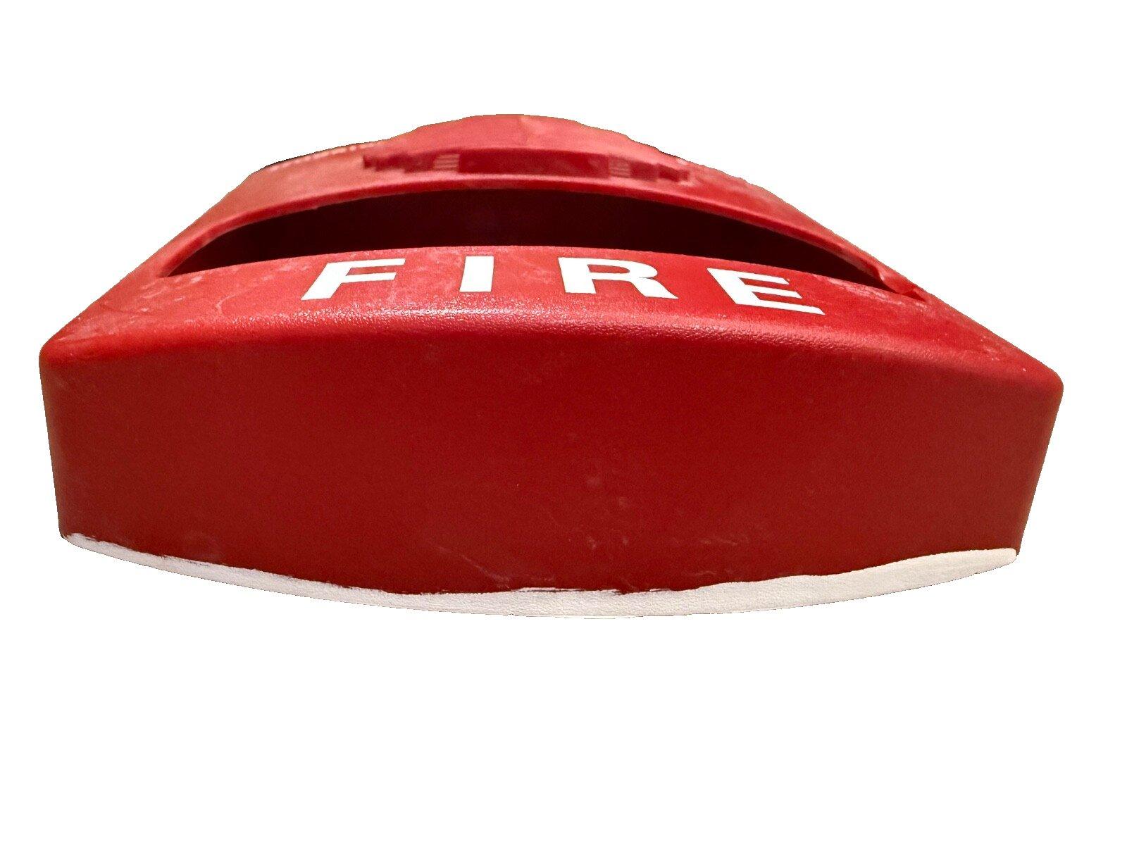 Red fire alarm pull station cover with white FIRE label, used in commercial fire safety systems