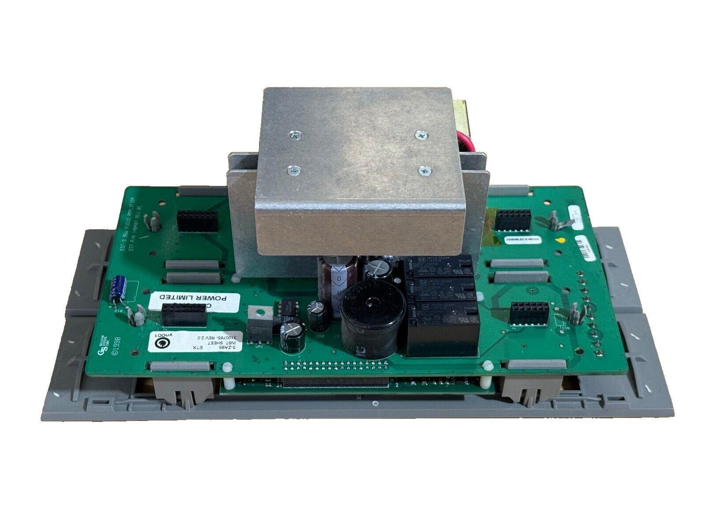 Fire alarm control panel circuit board with power supply module and capacitors