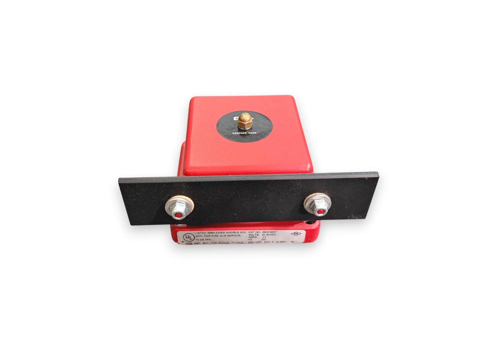 Red fire alarm audible signal device with black mounting bracket, UL listed for fire alarm systems