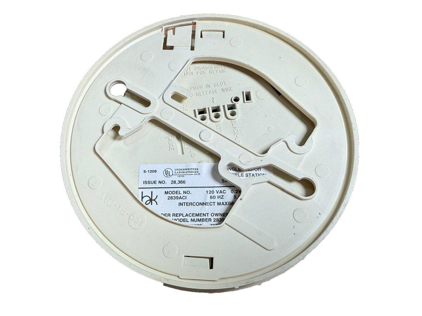 White fire alarm base with UL label, model 2839ACI, for smoke detector installation