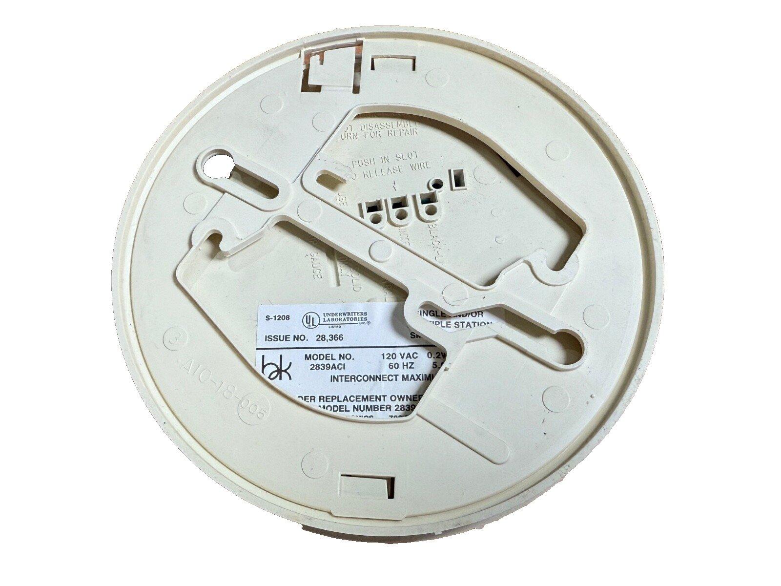 White fire alarm base with UL label, model 2839ACI, for smoke detector installation